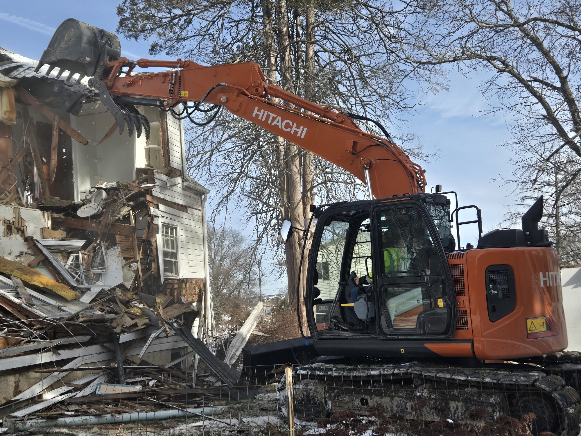 Excavator tearing down a commercial structure in Annapolis, MD