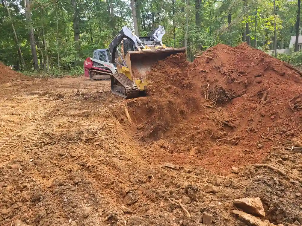 Skid steer working a cleared lot in Frederick, MD